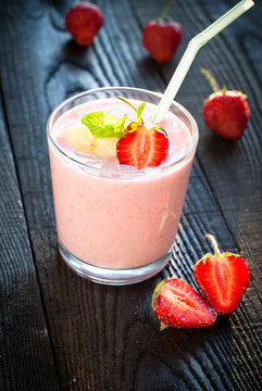 Glass of smoothie with strawberries