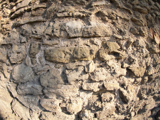 Stone wall of the large rough stones gray