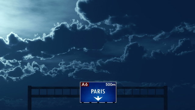 Passing under Paris France Highway Road Sign at Night
  