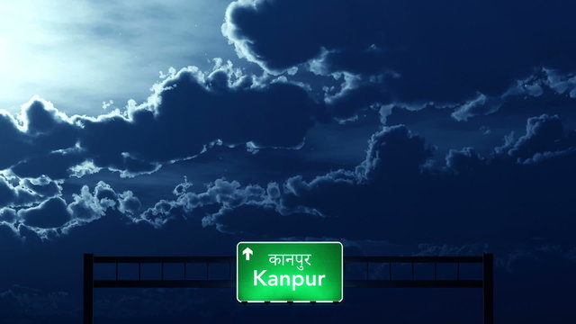 Passing under Kanpur India Highway Road Sign at Night
  