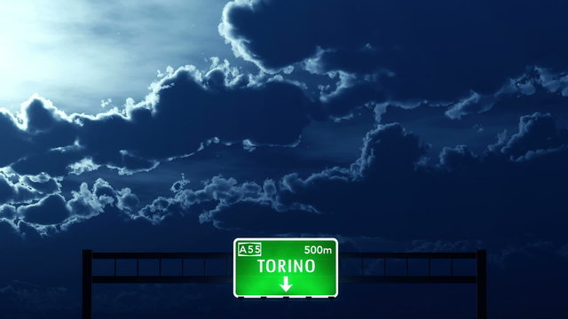 Passing under Torino Italy Highway Road Sign at Night
  