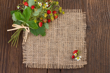 wild strawberries on rustic background