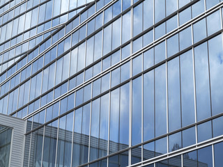 Fototapeta na wymiar Abstract blue glass facade modern business center building