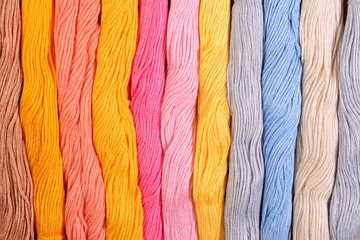 Colorful skeins of floss as background texture