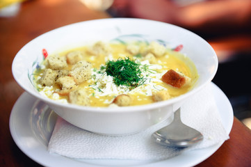 Healthy vegetable cream soup with dill and cheese in a bowl