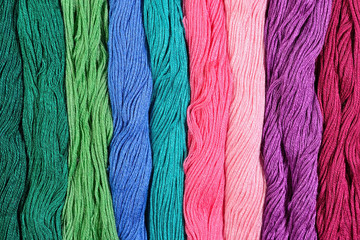 Colorful skeins of floss as background texture