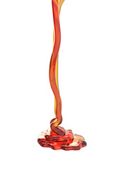 Honey flowing on white background.