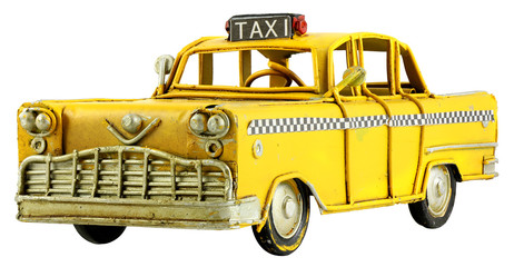 Old retro toy yellow taxi isolated on white background