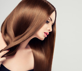 Beautiful girl with brown hair .Long straight hair Shine 
