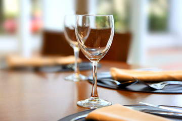 Close up shot of two empty wine glasses