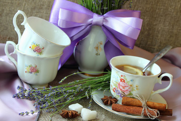 Cup of tea and bouquet of lavender.