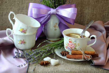 Cup of tea and bouquet of lavender.