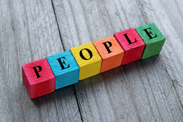 word people on colorful wooden cubes