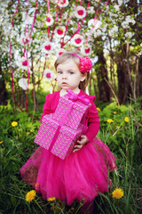 little girl with birthday presents - 84855246