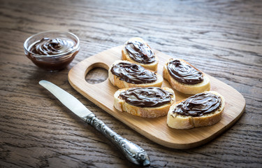 Slices of baguette with chocolate cream