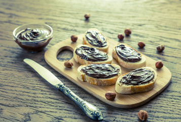 Slices of baguette with chocolate cream