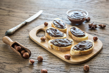 Slices of baguette with chocolate cream