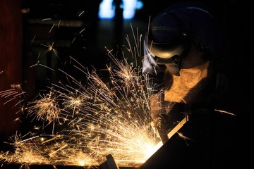 Welder is cutting frame by carbon air arc gouging