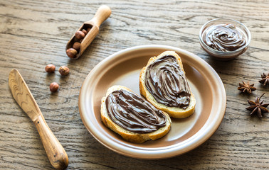 Slices of baguette with chocolate cream