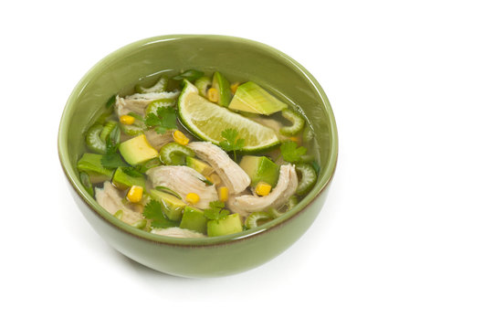 Chicken Avocado Lime Soup on White Background. Selective focus.
