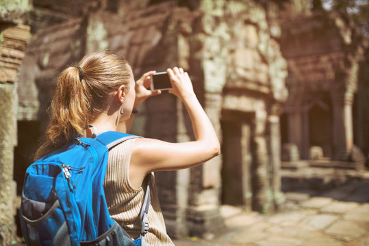 Tourist taking a picture of Preah Khan temple. Angkor, Cambodia