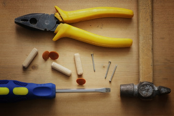 Fototapeta na wymiar set of screwdriver pliers hammer nails