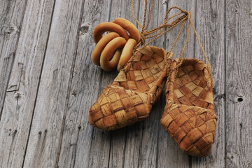 Braided sandals on wood