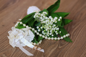 Wedding bouquet of lilies of the valley accessory ring