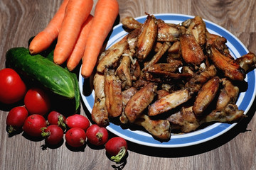 chicken wings and drumstick served with