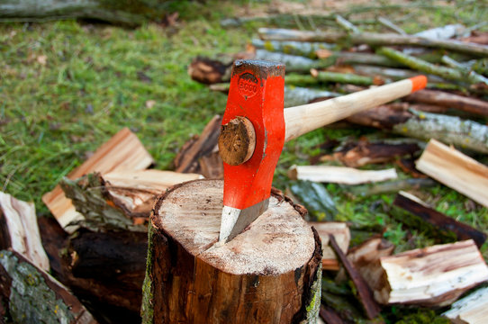 Axe on a wood log