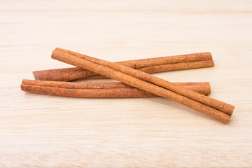 Cinnamon sticks on wooden table