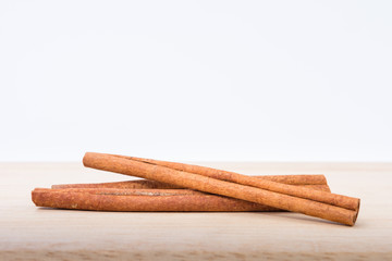 Cinnamon sticks on wooden table