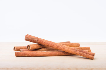 Cinnamon sticks on wooden table