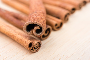 Cinnamon sticks on wooden table