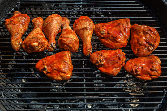 Chicken legs smoked barbeque cooked on charcoal grill