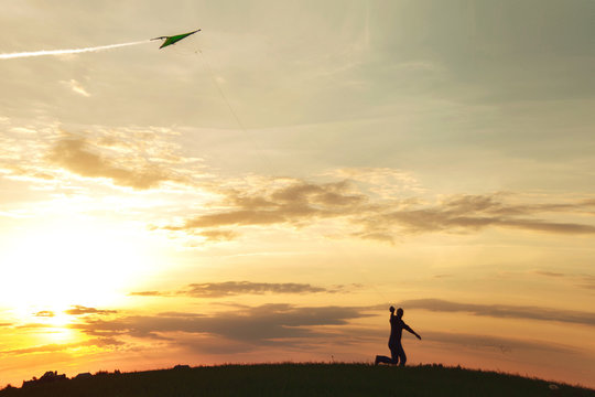 A man launches a kite 


