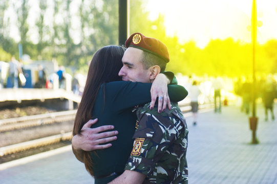 girl meets a soldier at the station in Ukraine