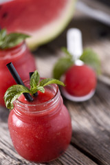 Water melon smoothie on wooden table