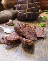Slices of sausages and gammon ham