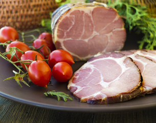 gammon ham with tomotoes and juniper on plate