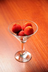 strawberries in a glass on the table