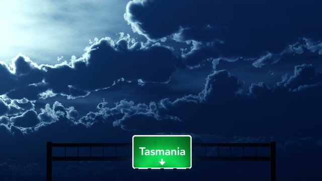 Passing under Tasmania Australia Highway Road Sign at Night
  