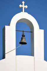 White church in Greece at a blue sky