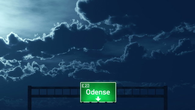 Passing under Odense Denmark Highway Road Sign at Night
  