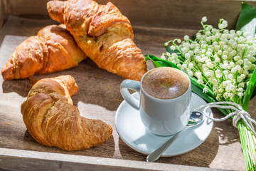 Delicious croissant and hot coffee