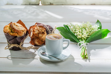 Tasty hot coffee and sweet muffin