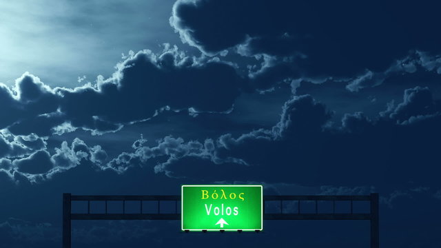 Passing under Volos Greece Highway Road Sign at Night
  