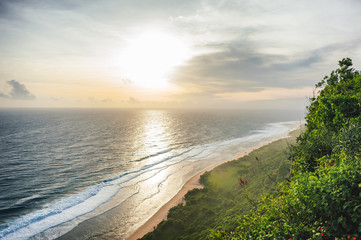 Day seascape with waves and trees