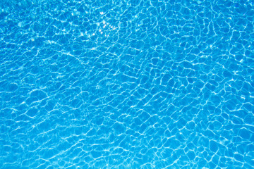Blue and bright water surface in swimming pool