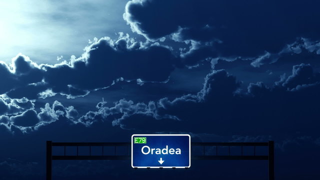 Passing under Oradea Romania Highway Road Sign at Night
  